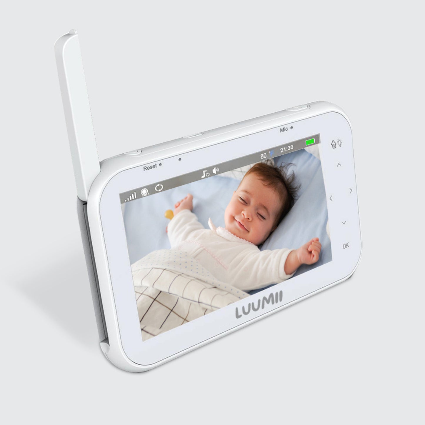 Skjermen på Luumii babymonitor viser en baby som sover trygt i sengen